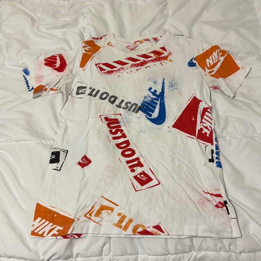 White Nike tee with colorful Nike print